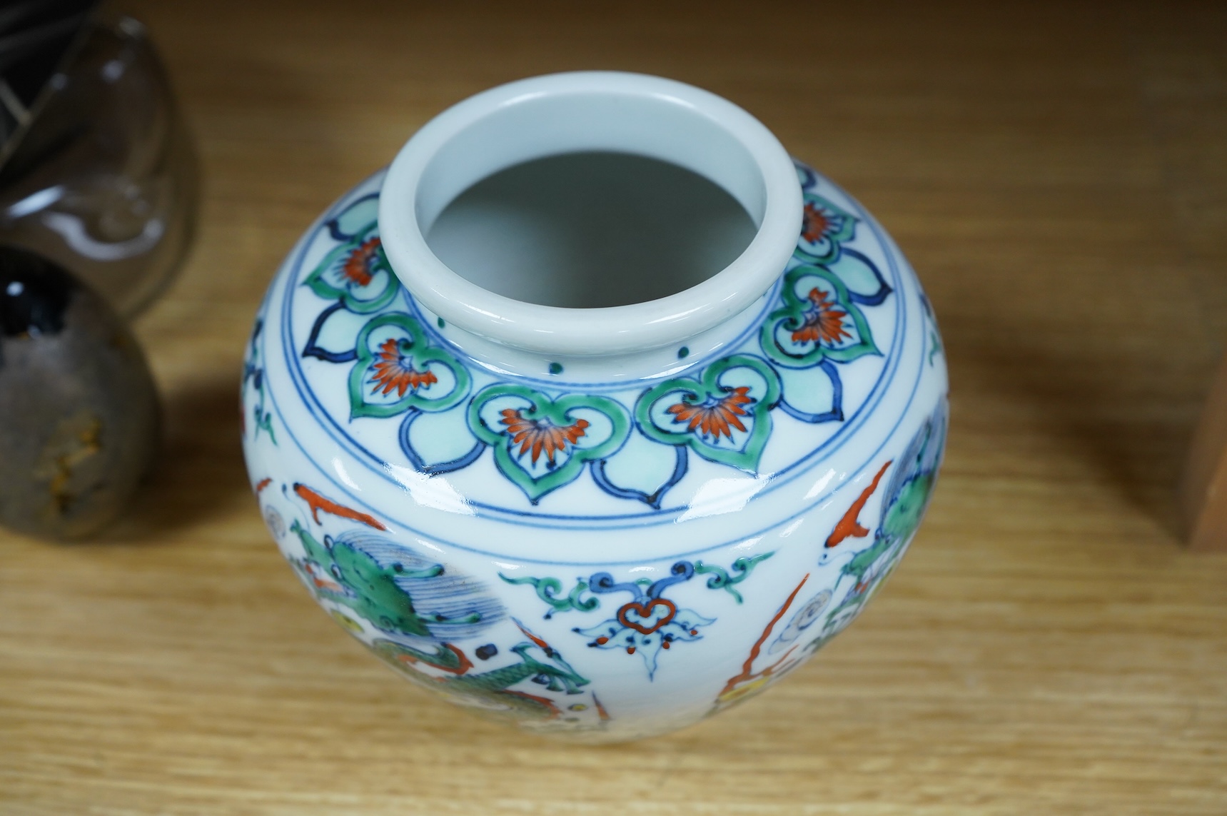 A Chinese doucai 'dragon' roundel vase, Kangxi mark but later, 13cm